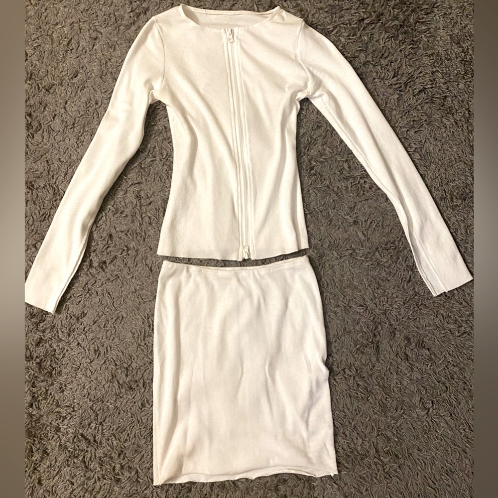2 piece skirt with long sleeve zipper top. Very simple and sexy.